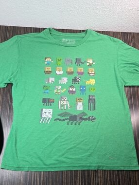 Green Pixel Character Graphic Tee